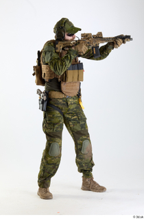 Andrew Elliott Task Forcee Pose with Gun aiming gun standing…